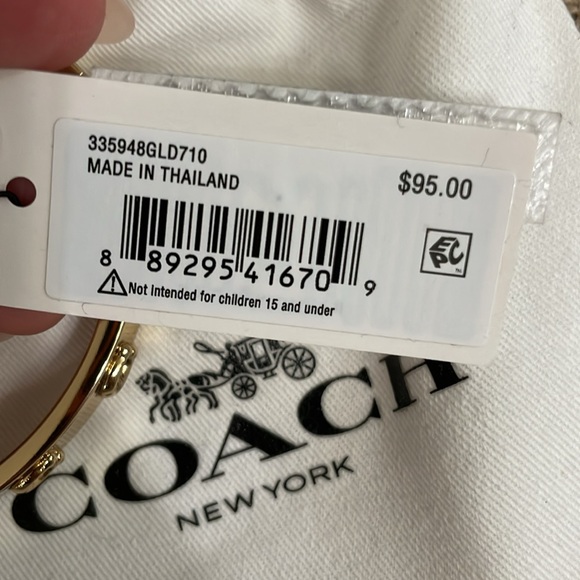 COACH. Brand new. Pegged Signature Hinged Bangle. Gold. Tags attached. - Picture 3 of 3